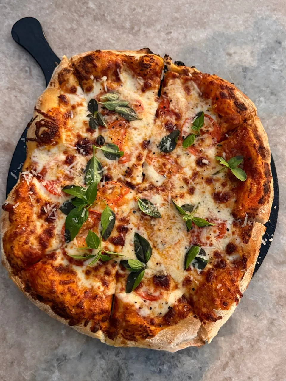 Signature gourmet pizza at The Source restaurant Muscat made by award-winning chef